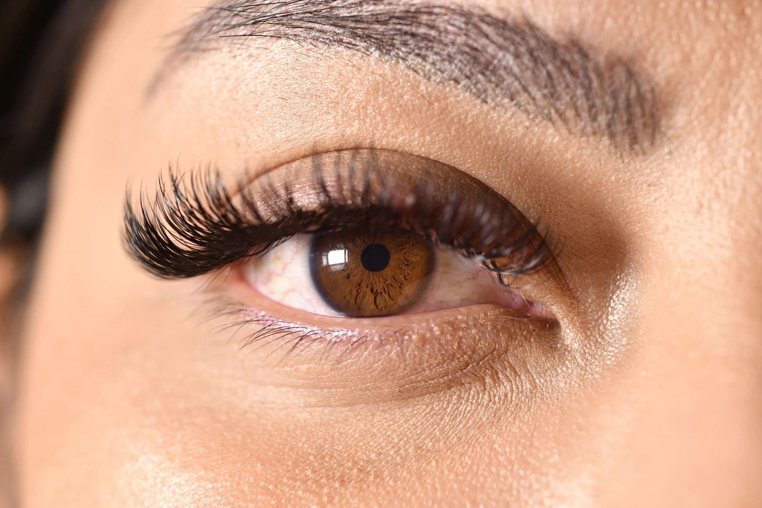 a-close-up-of-a-brown-eye-with-long-eyelashes-and-2026-01-07-06-09-22-utc.jpg