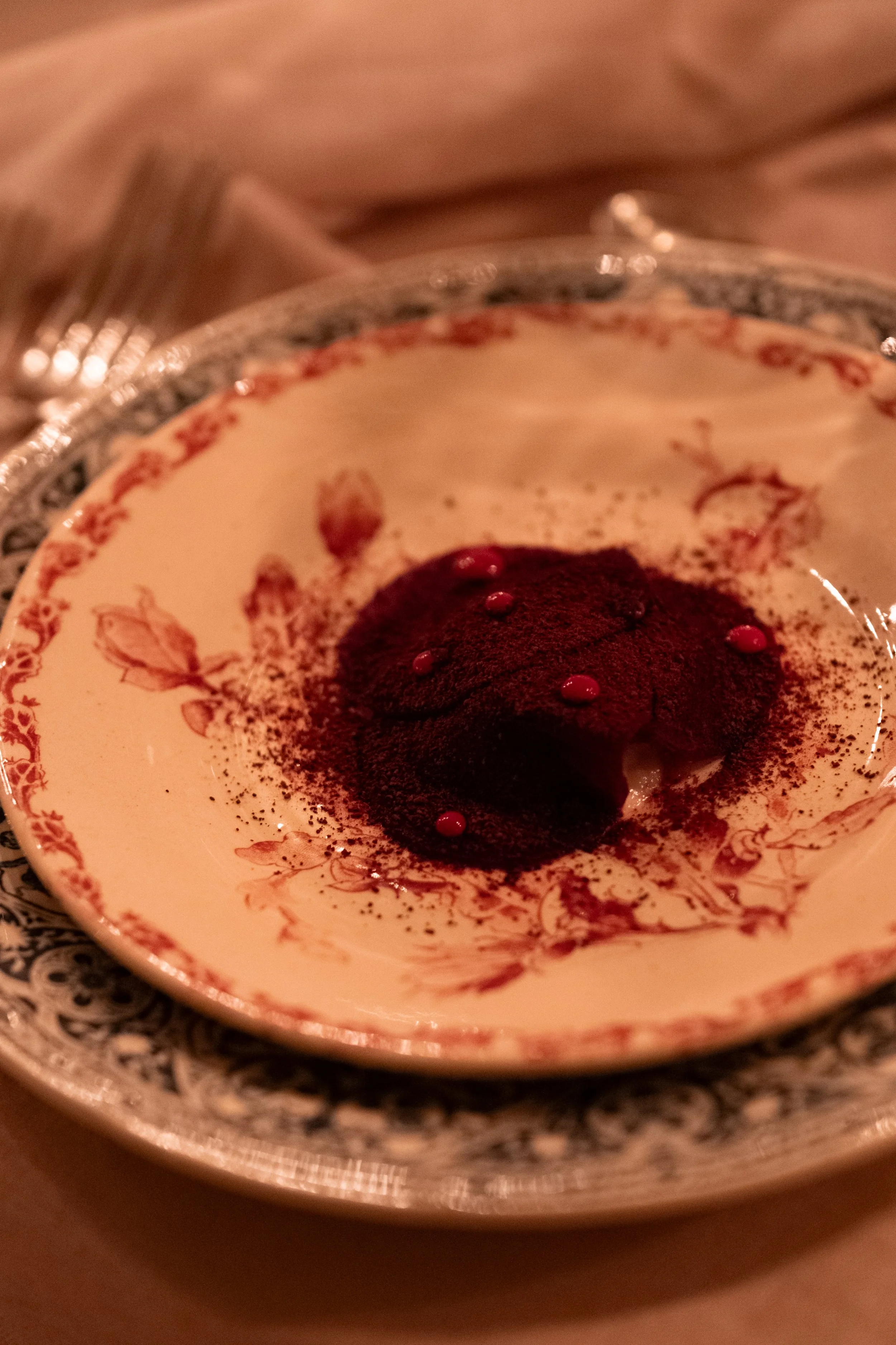 Chocolate mousse dessert on ornate silver tray at a private dinner in Marrakech