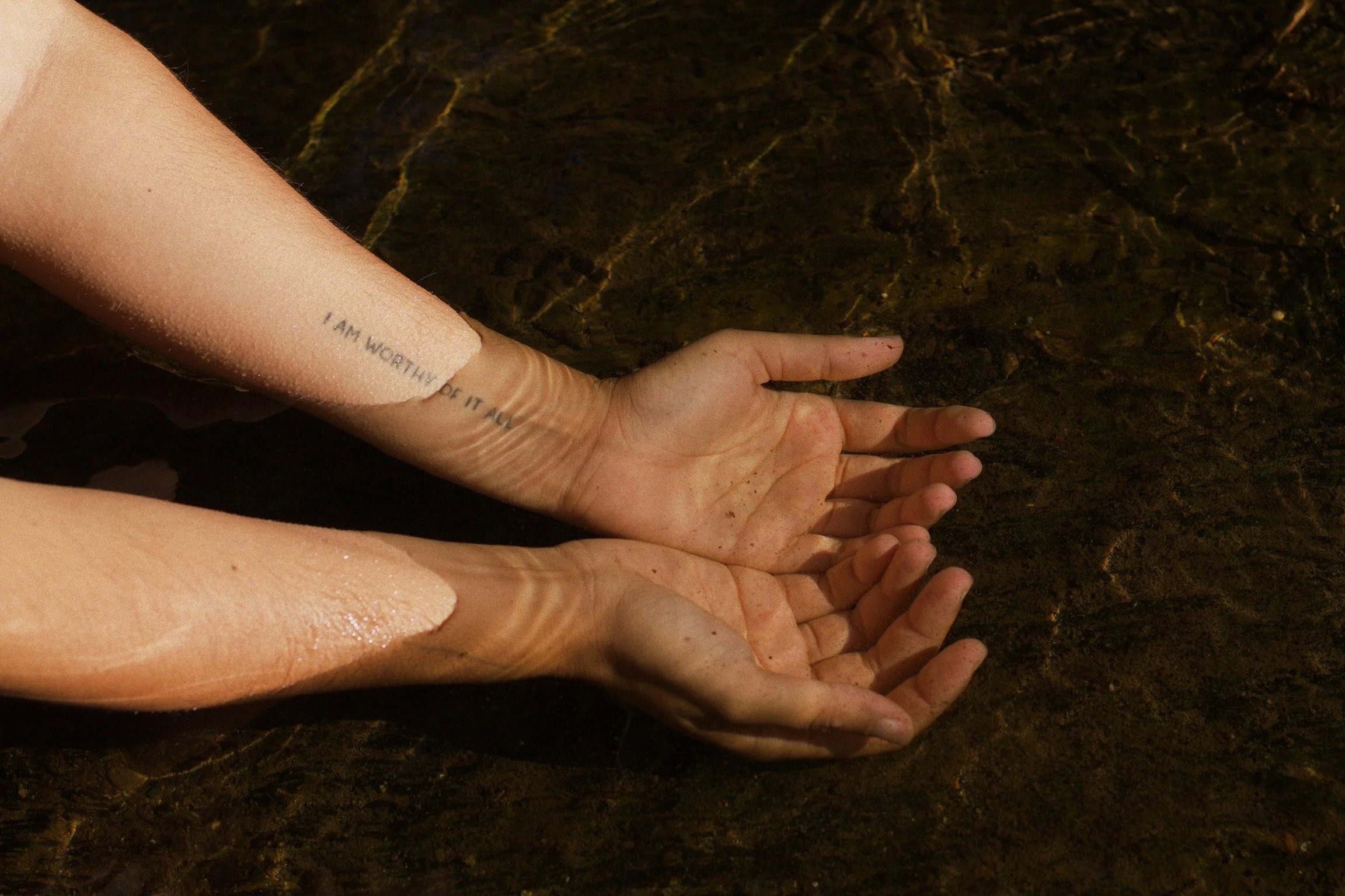 hands in water