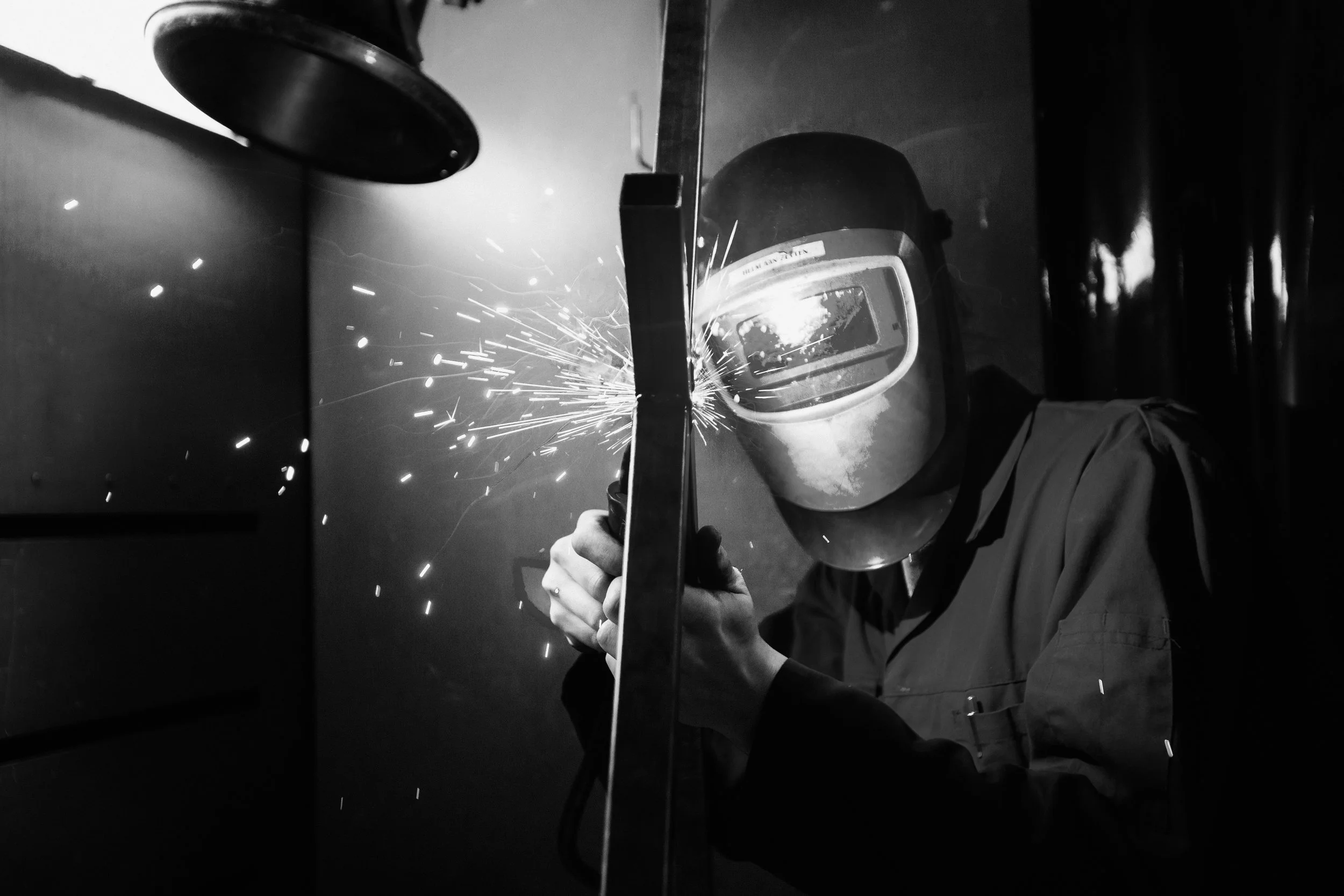 Archive: plasticiet founder Joost wearing welding a metal piece in the studio.