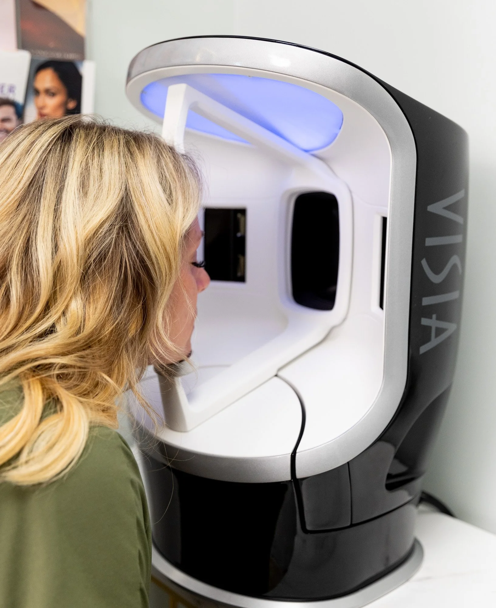 A woman with blonde hair undergoing a medical imaging procedure using a Viasys-type MRI machine.