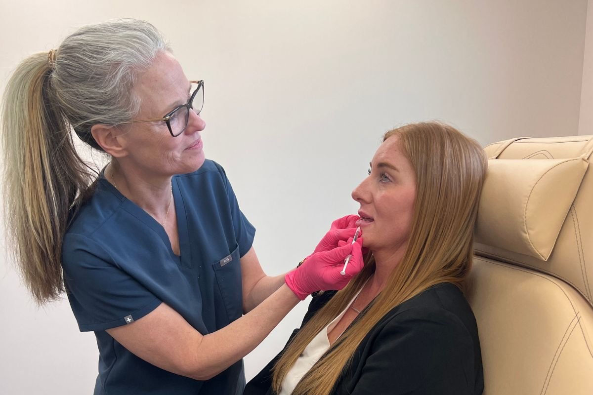 A woman receiving Dermal Lip Filler ath the Skin CLinic, Mankato, Mn