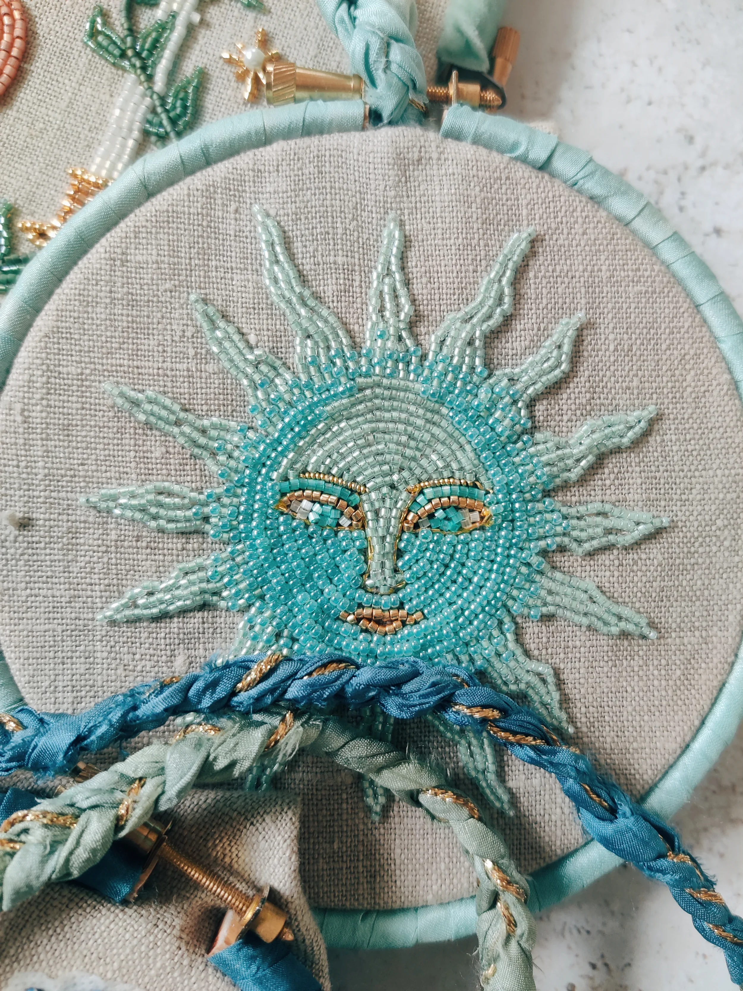 embroidery_ocean_sun.webp