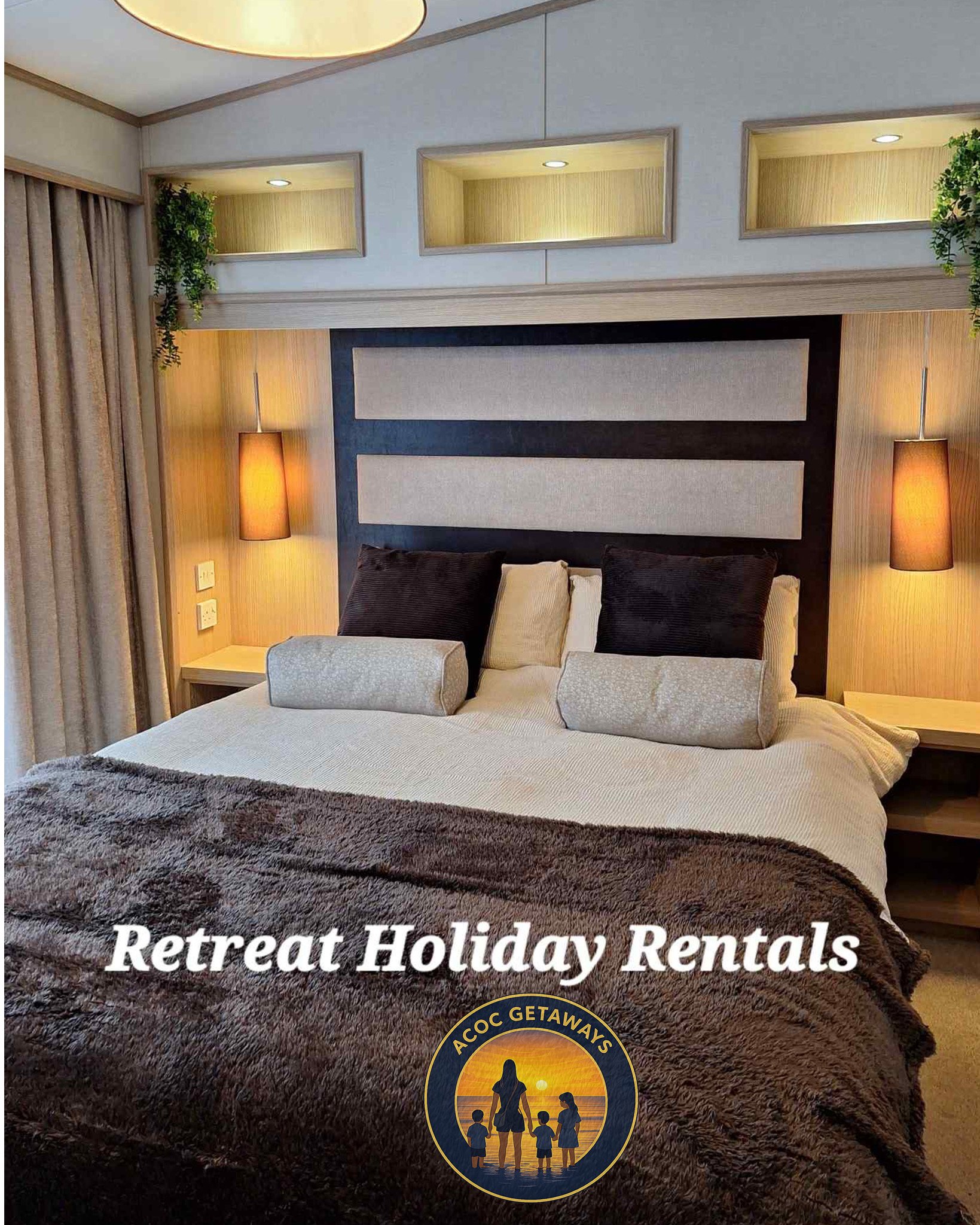 A cozy hotel bedroom with a large bed, black and beige pillows, beige bedding, and a brown furry blanket. There are two nightstands with lamps on each side of the bed, and decorative niches with greenery above. The room has beige curtains and modern lighting.