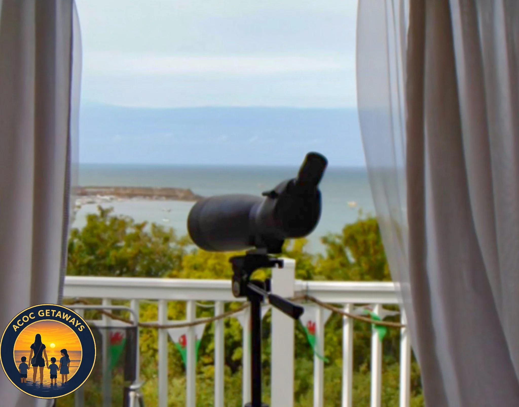 A telescope on a balcony overlooking the ocean with trees in the foreground and a cloudy sky.
