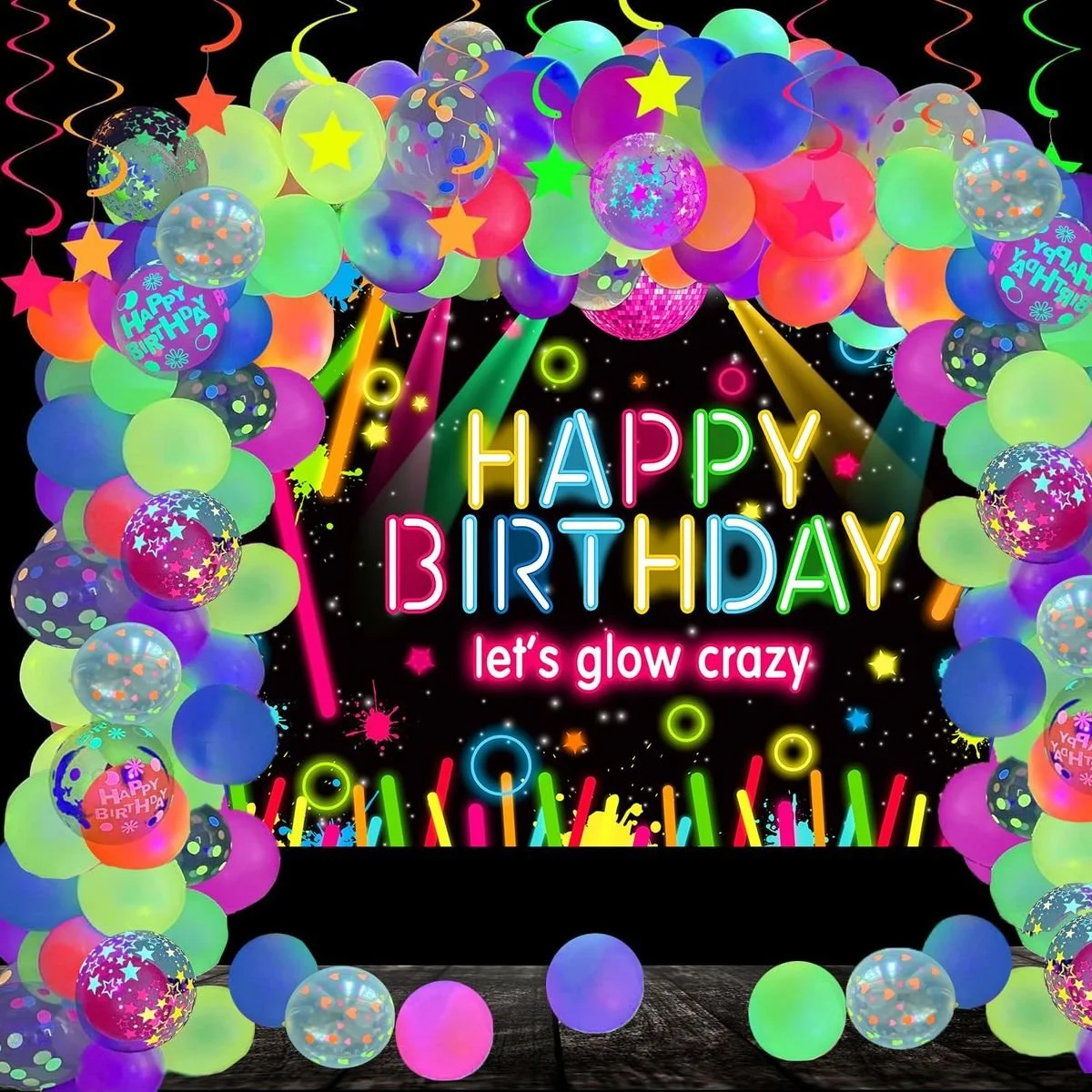 Bright birthday celebration with neon balloons, colorful confetti, and a digital sign reading 'Happy Birthday, let's glow crazy' in neon colors, set against a starry black background.