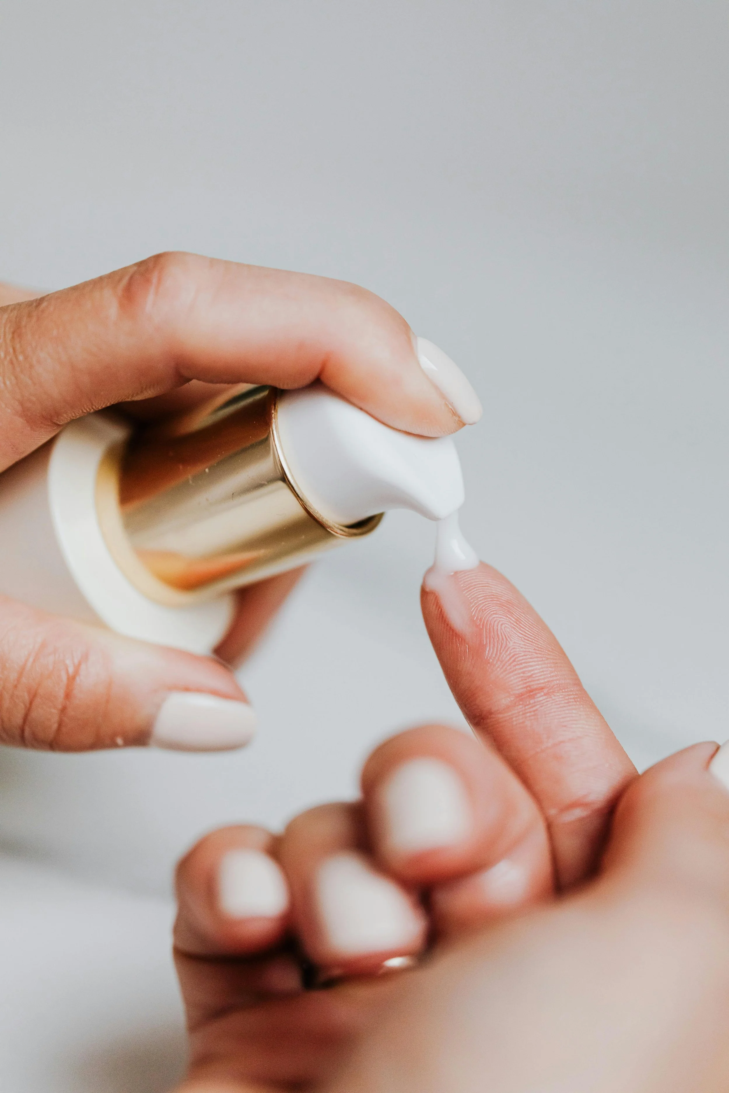 Closeup of woman using skincare products for acne treatment colorado springs