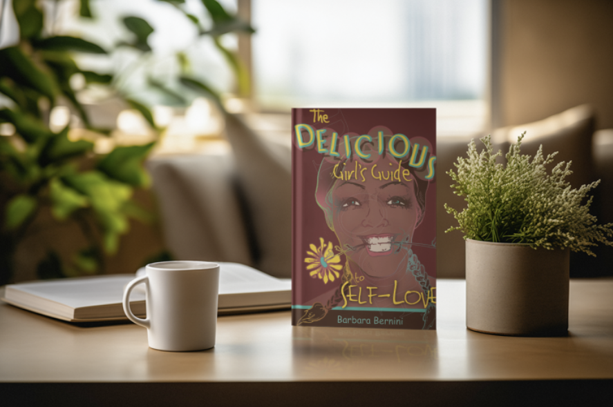 Book titled 'The Delicious Girl's Guide to Self-Love' by Barbara Bernini on a wooden table, with a white coffee mug, an open book, and a potted plant near a window.