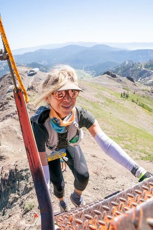 Woman climbing ladder during ultramarathon