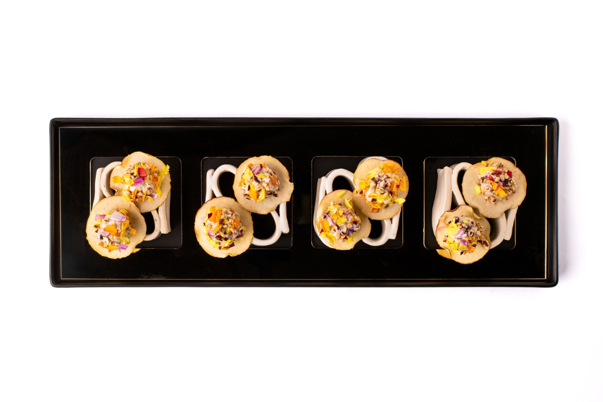 A platter of food sitting on a white background