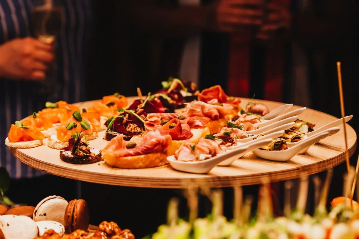 A platter if meats and breads for a catering event