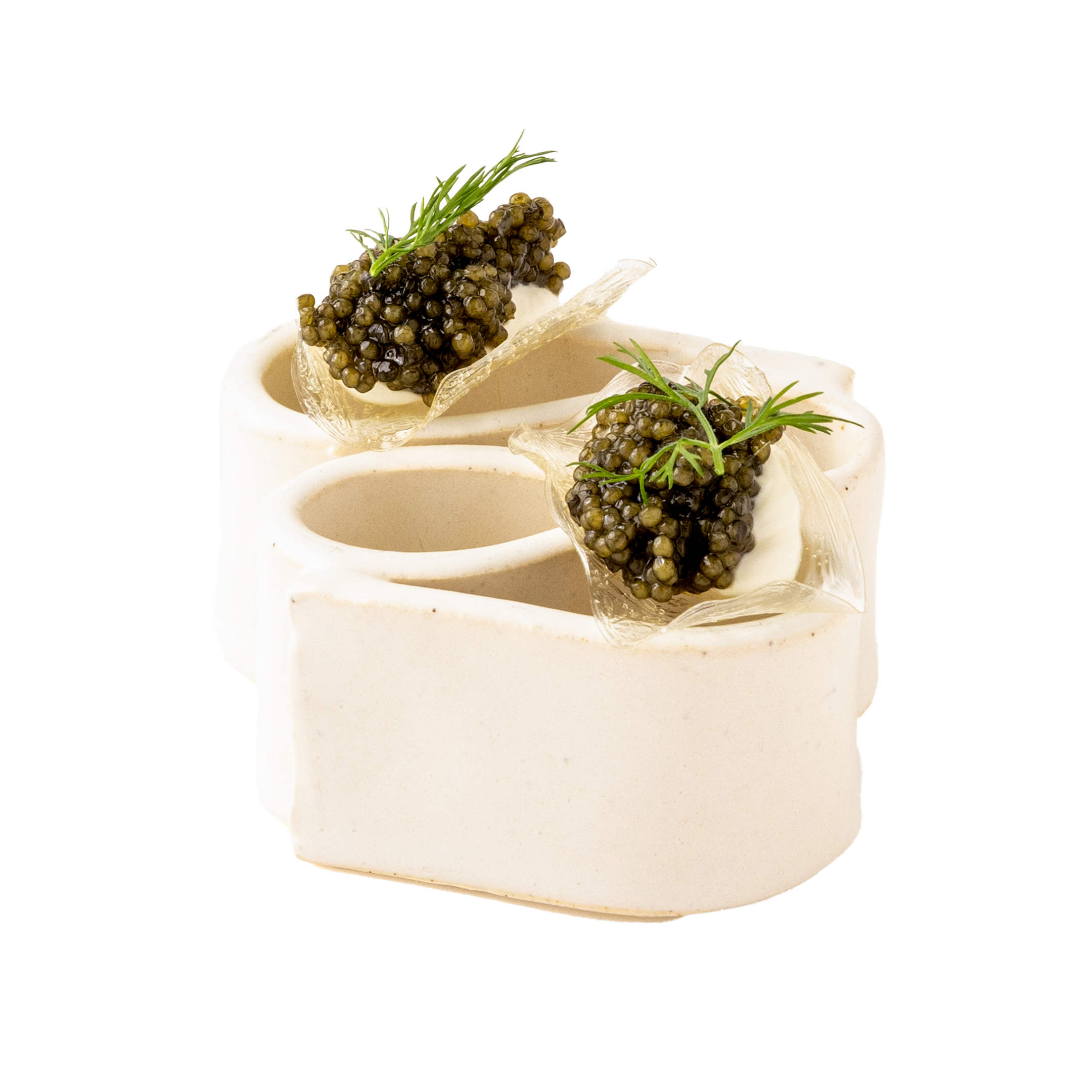 Elegant white cake decorated with black caviar and green garnishes.