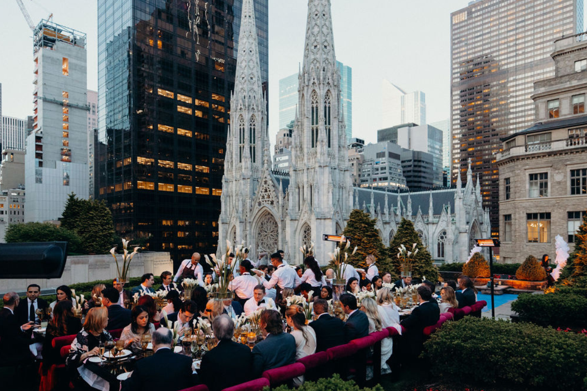 A bunch of people chilling on a rooftop wedding