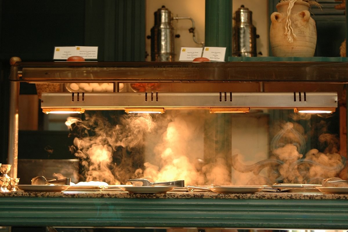 A buffet counter with steam coming from it