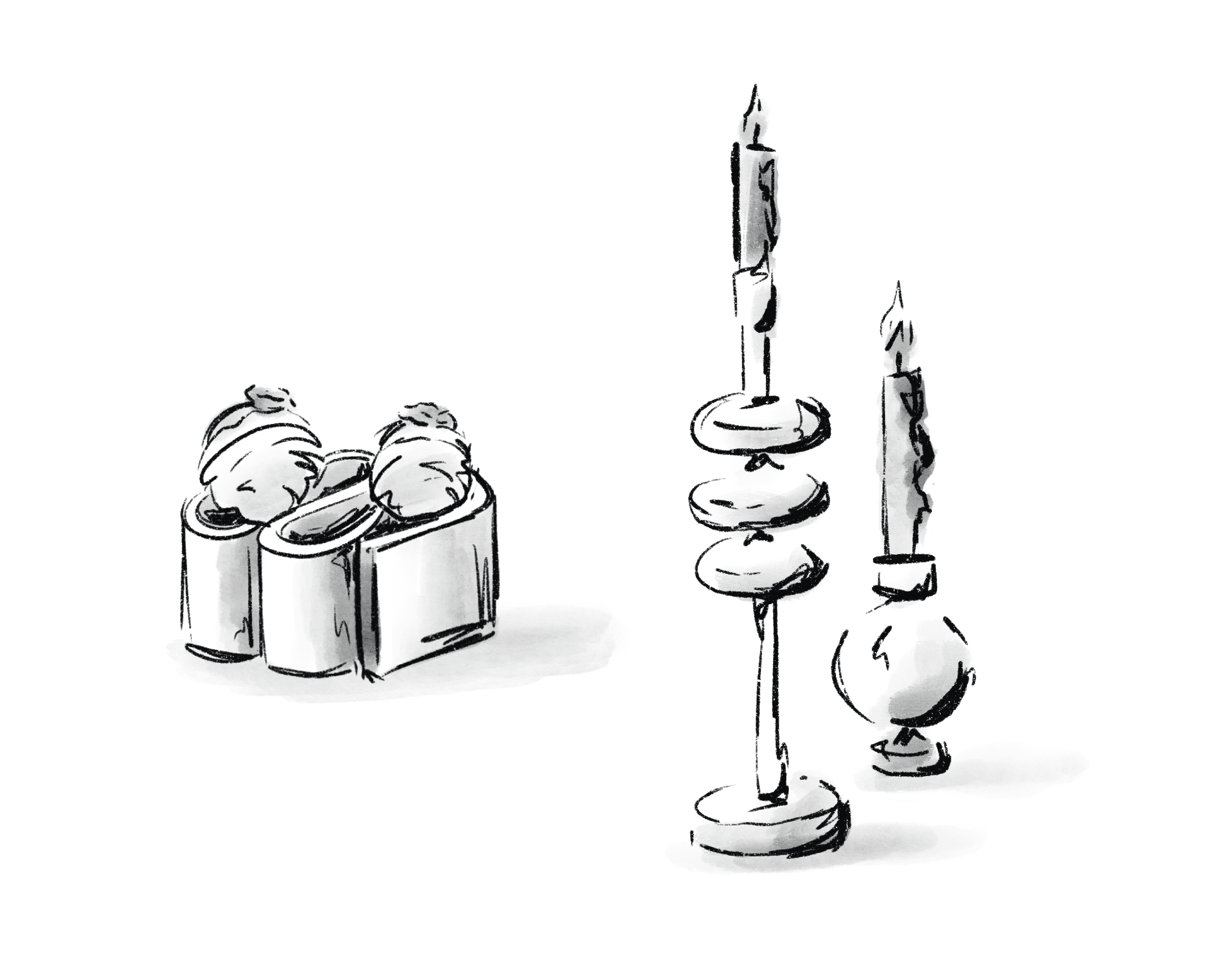 A collection of food next to some candles.