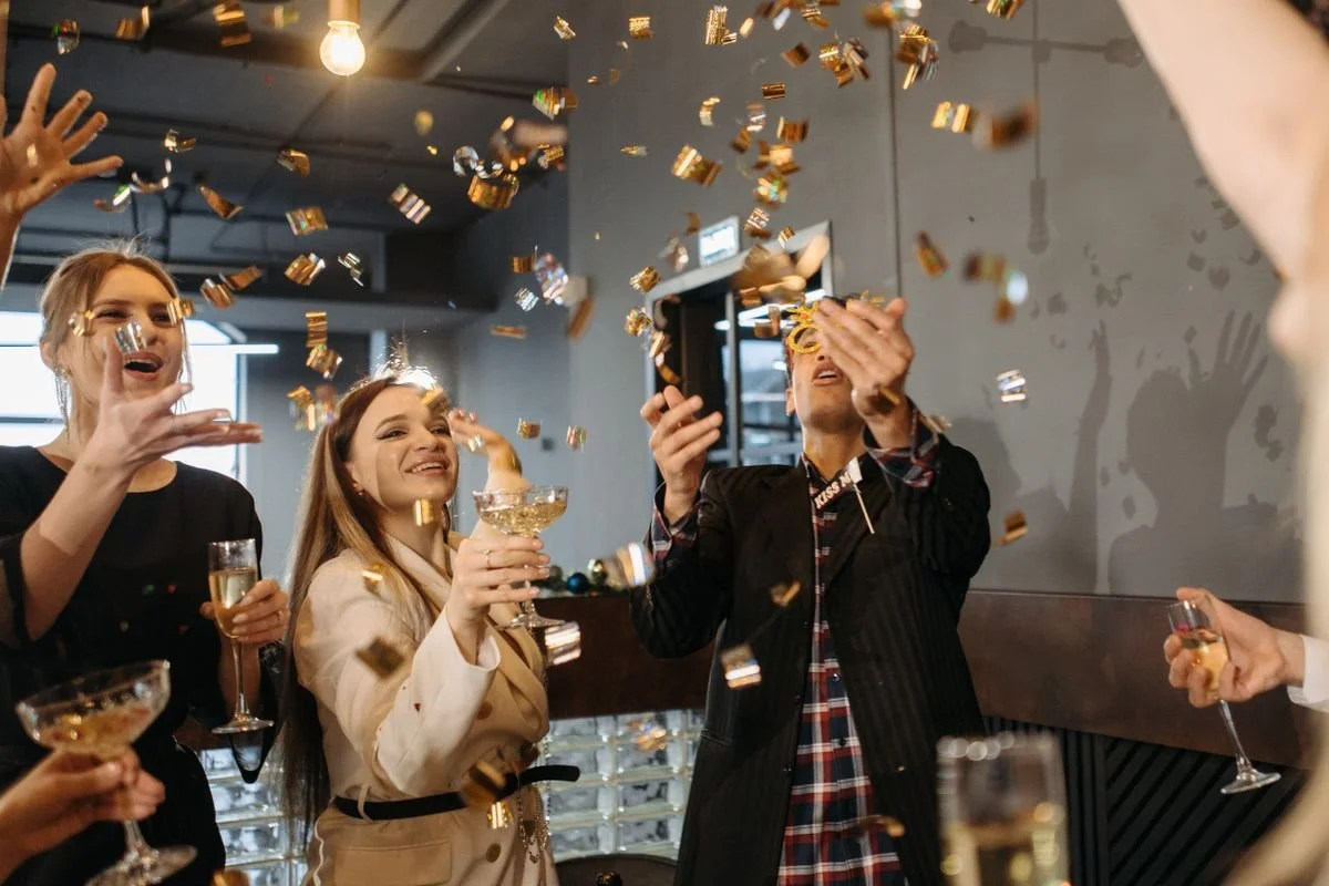 A bunch of people celebrating in a room