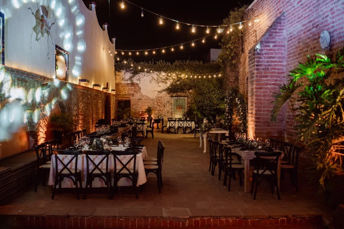 An outside venue with a bunch of tables and chairs