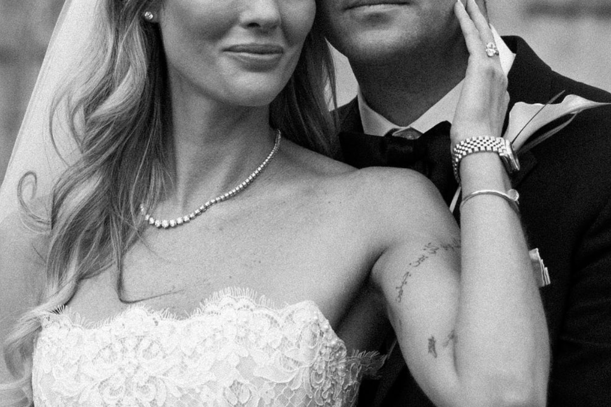 A couple taking a picture at a wedding