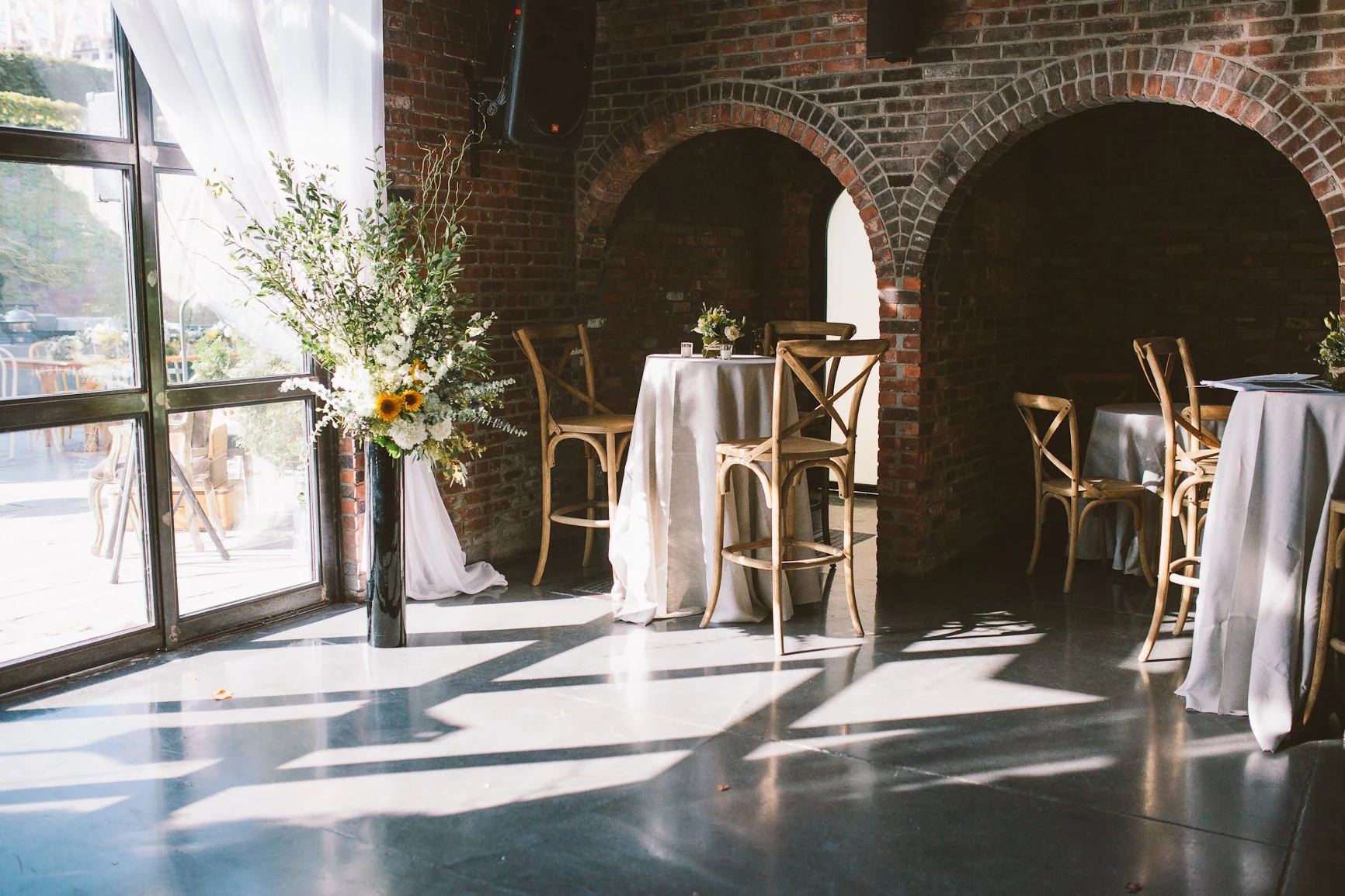 A small room with some empty chairs and tables