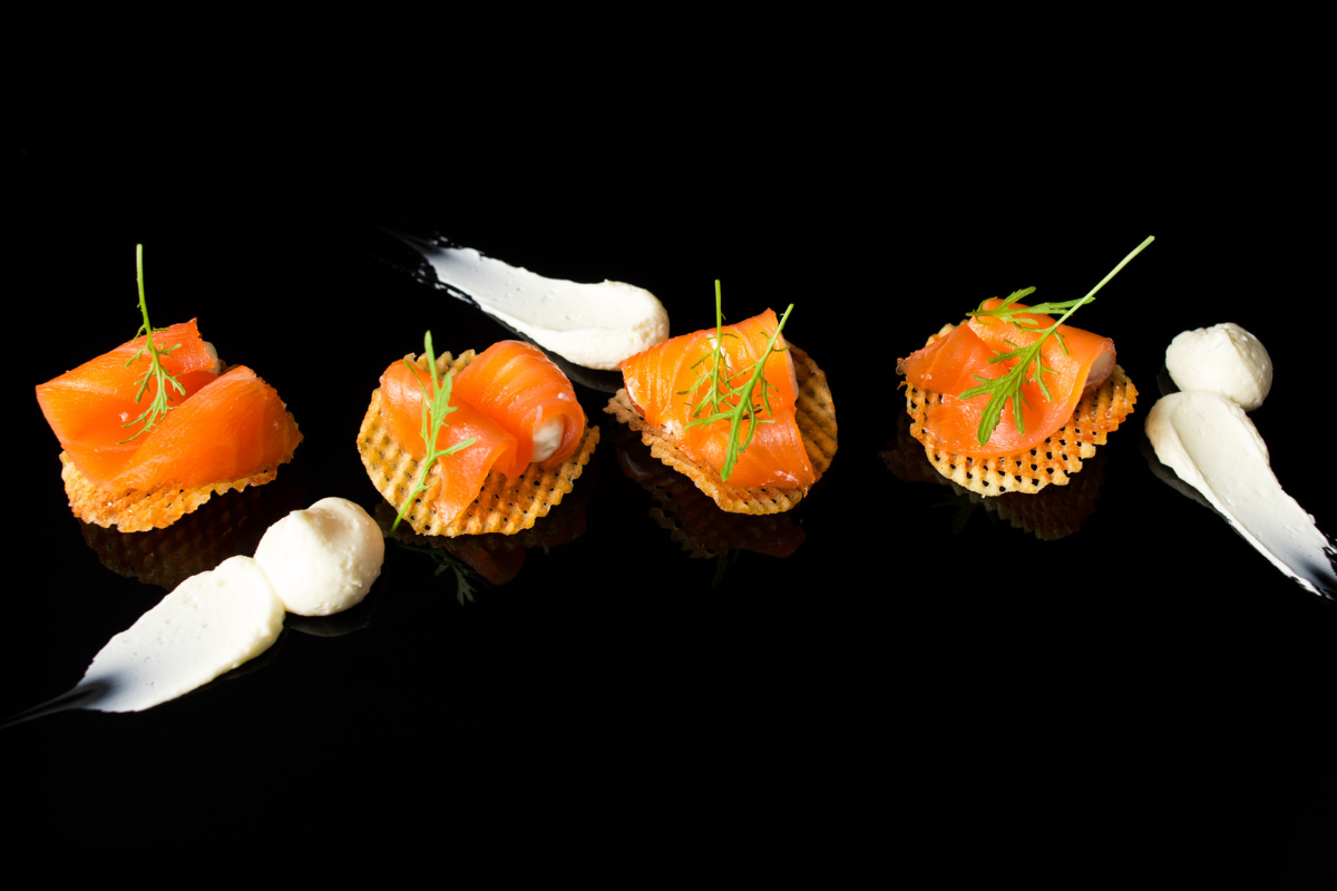 A black background with some food sitting on it