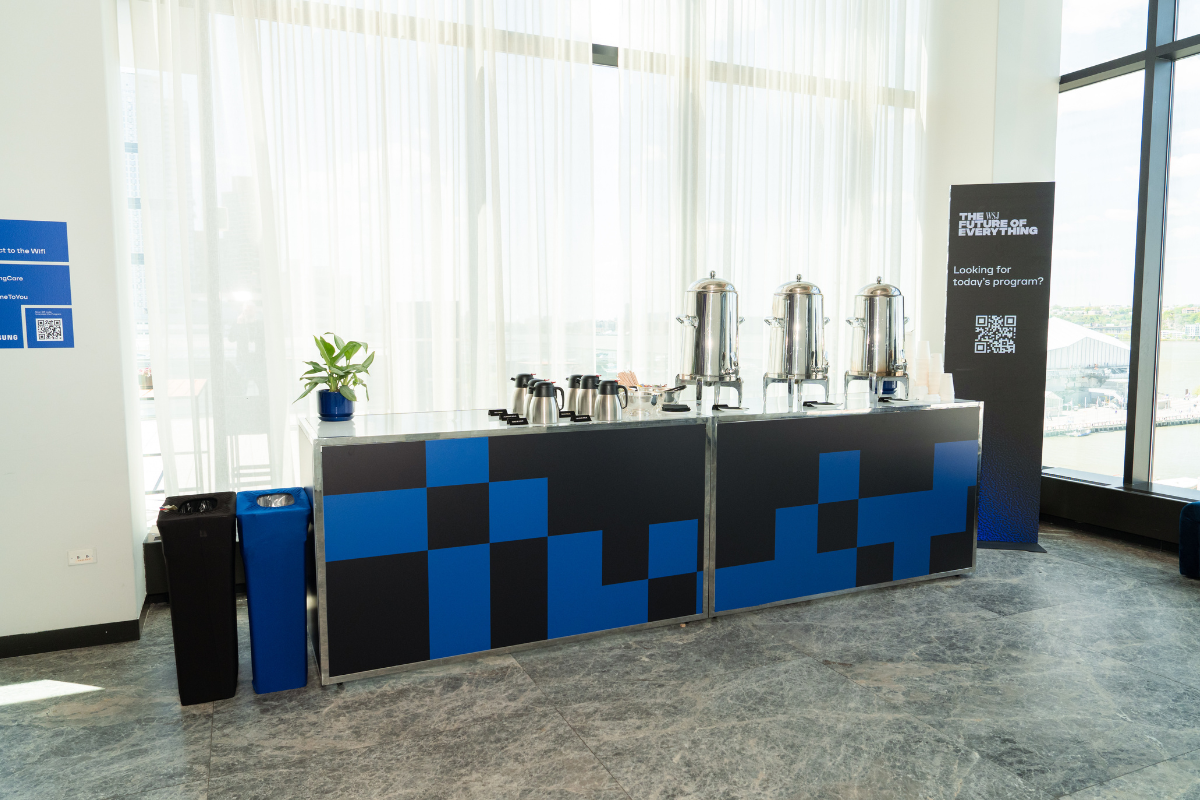A table with a bunch of coffee on it for a corporate event