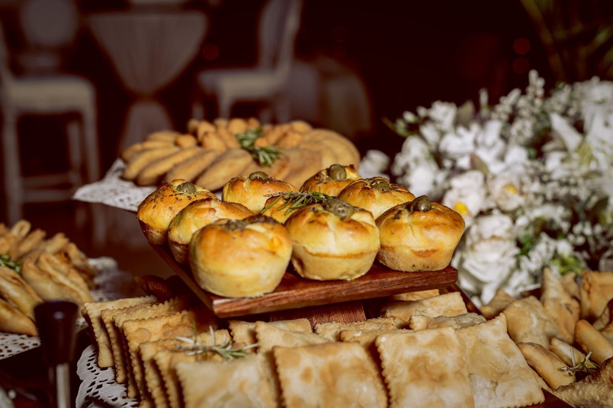 A bunch of food sitting on a table ready for people to eat