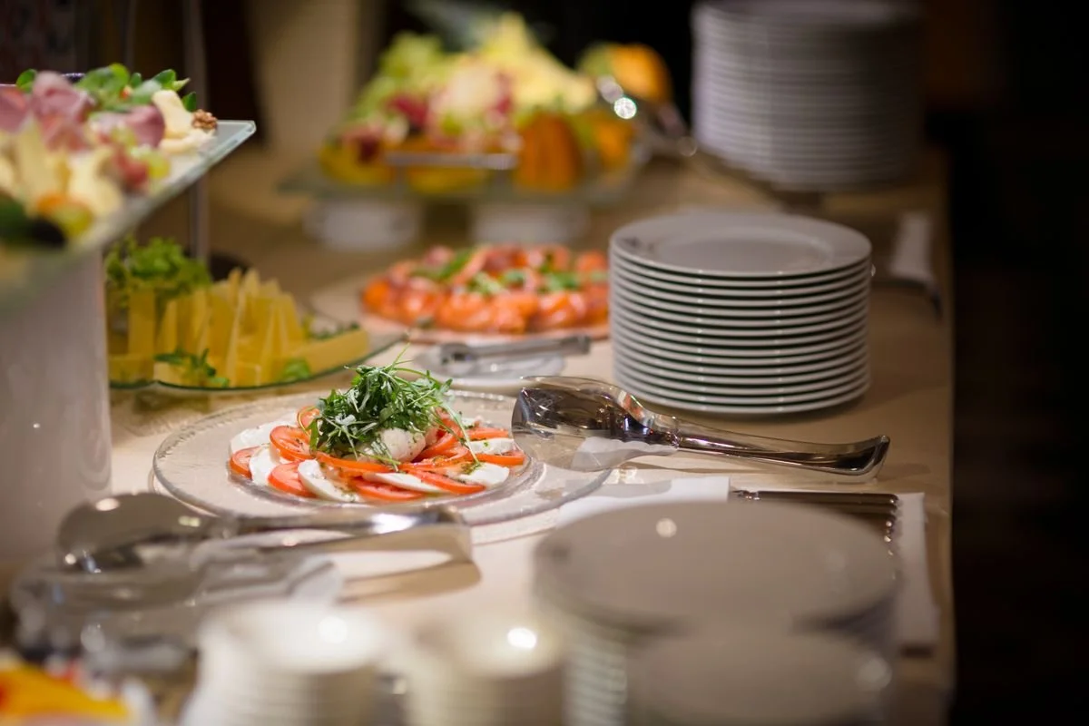 A table with a bunch of plates and food on it