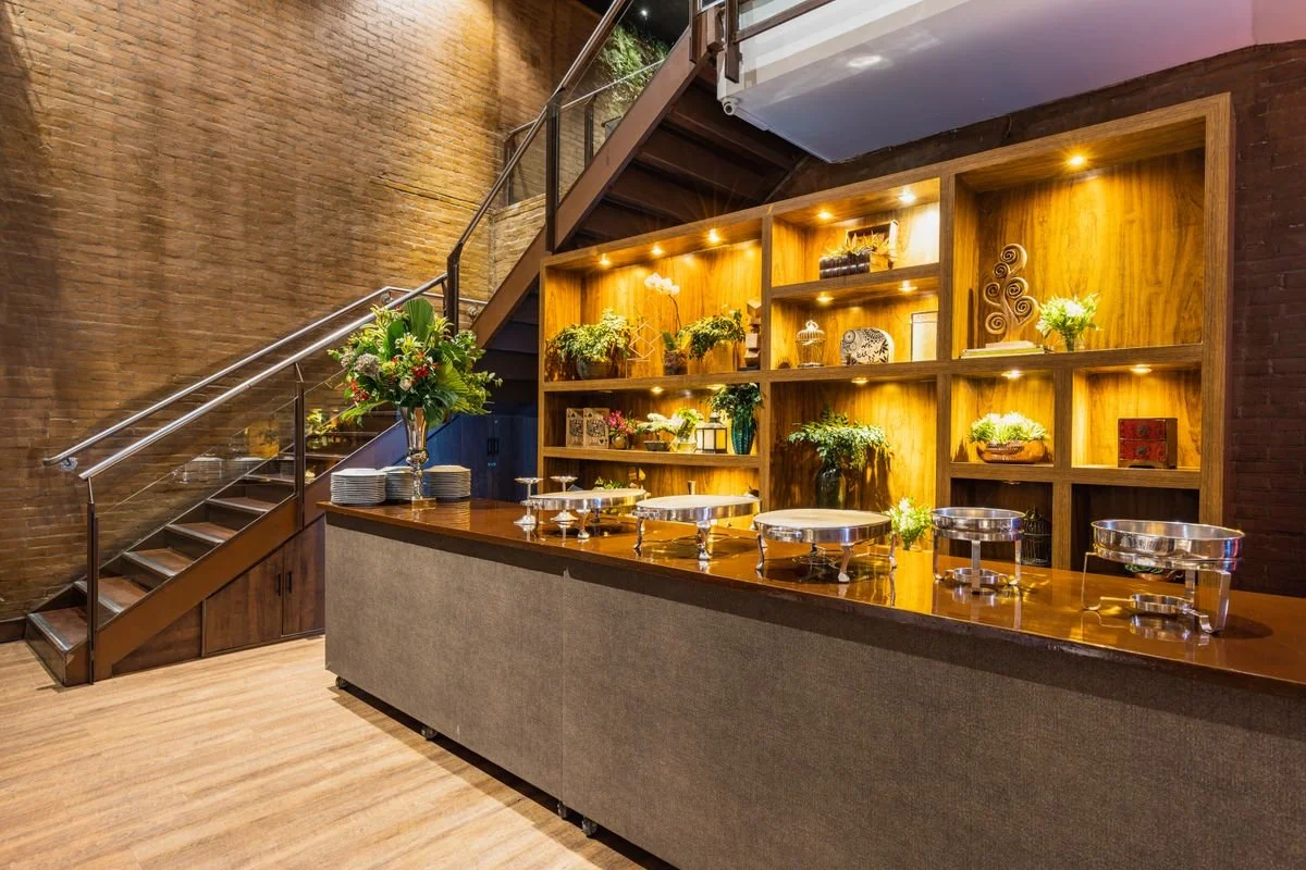 A small room with some sections on a counter for catering