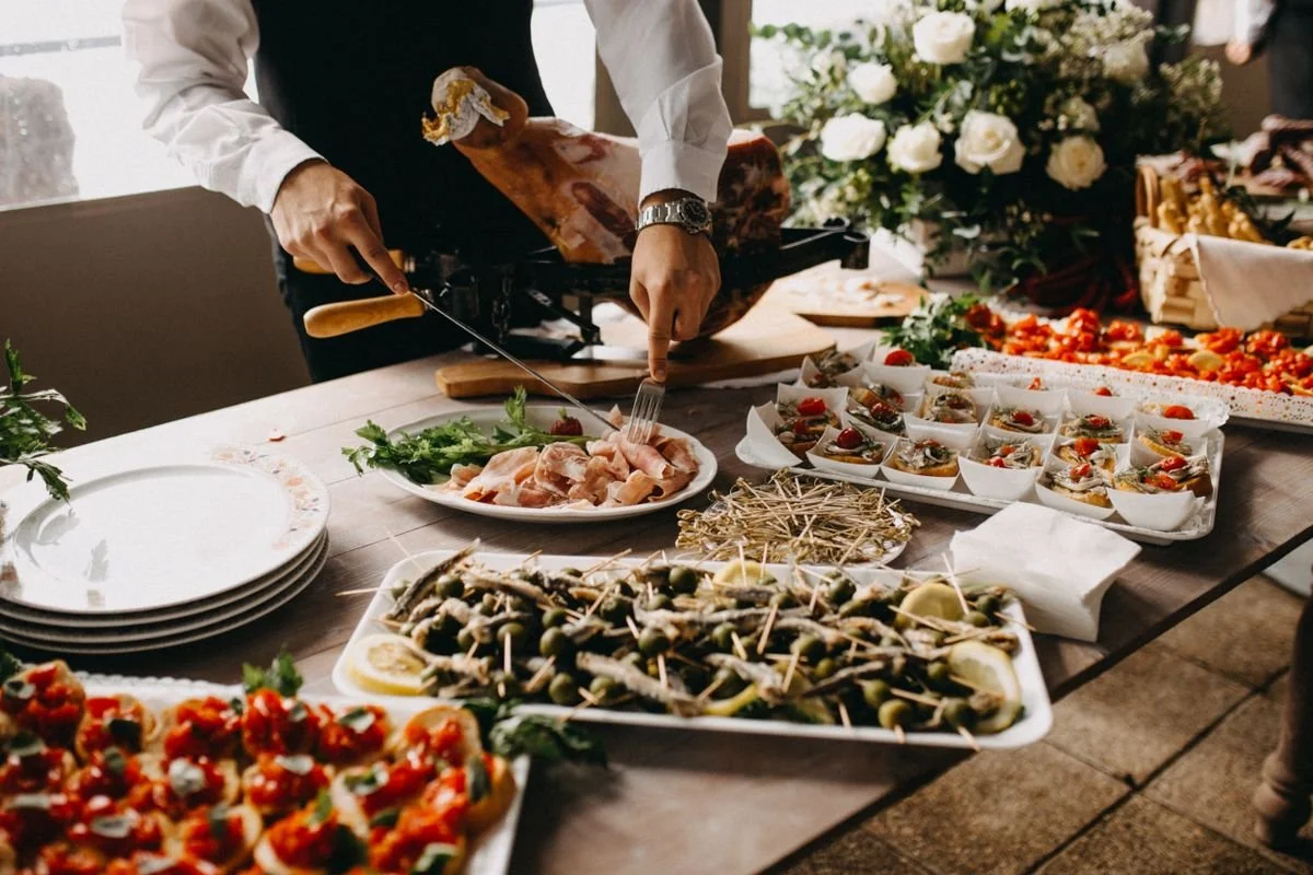 A server cutting up some food on a plate