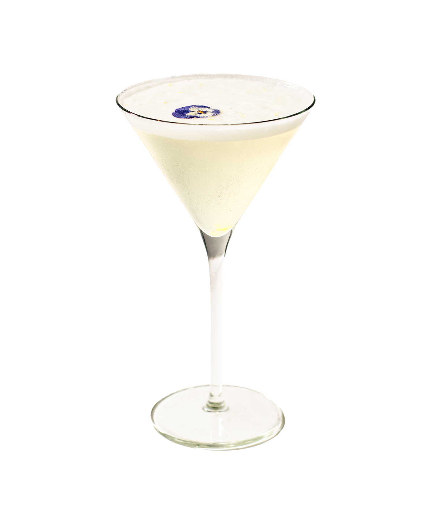 A glass of a light-colored cocktail, garnished with an edible purple flower on top, served in a martini glass.