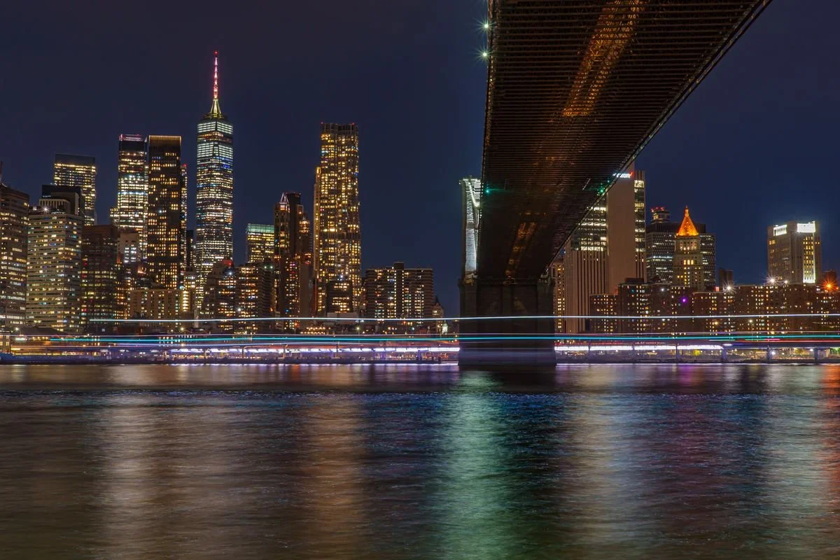 A view of New York City from the water at night time