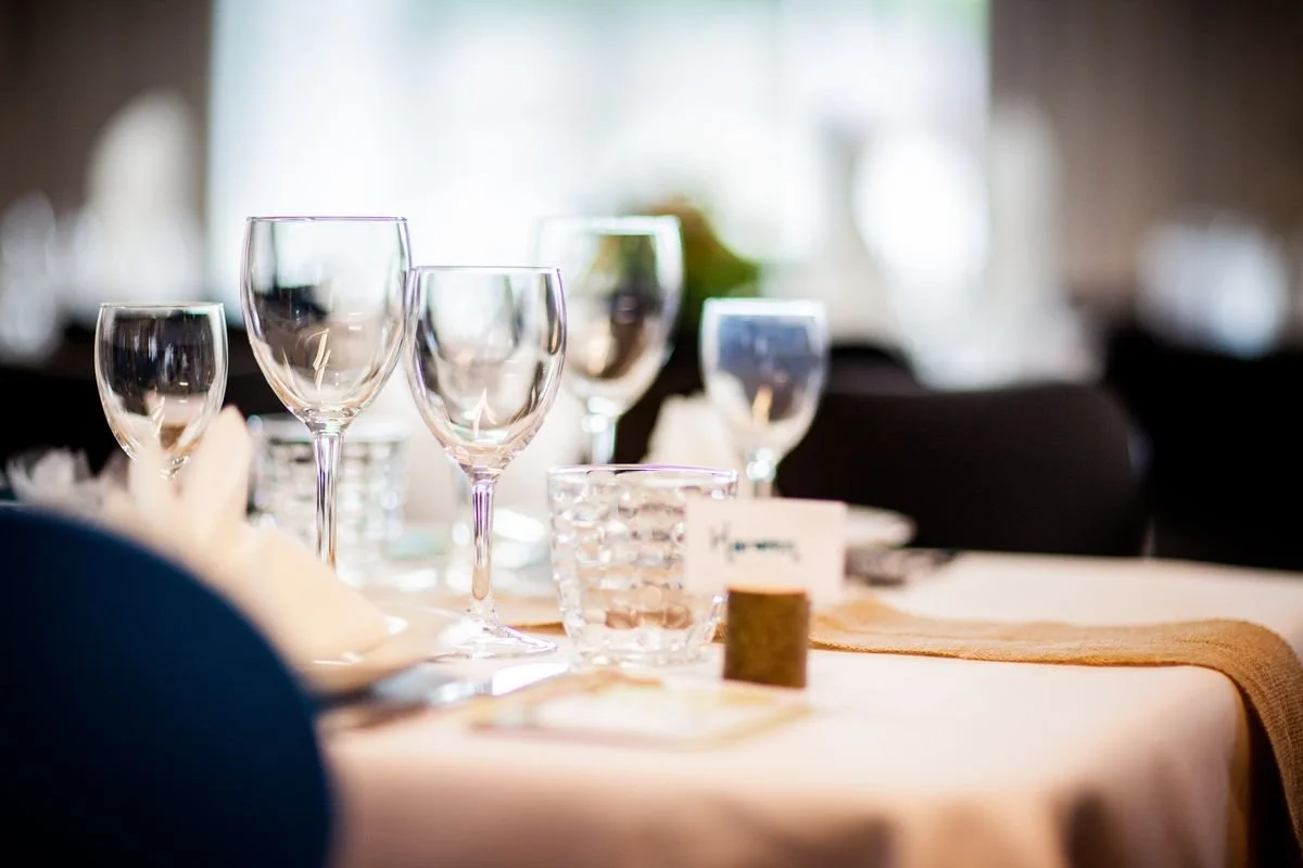 A table with a bunch of glasses on it