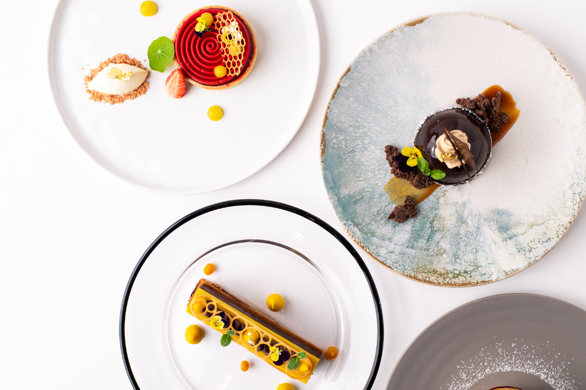 Plates with dessert on them with a white background
