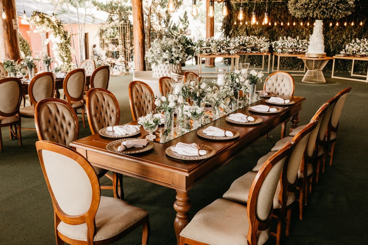 A wedding catering event with a bunch of tables and chairs