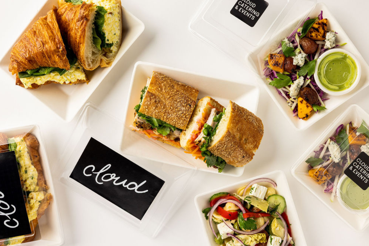 A bunch of platters of sandwiches