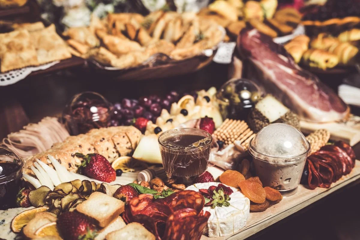 A table covered in all sorts of food for a catering event