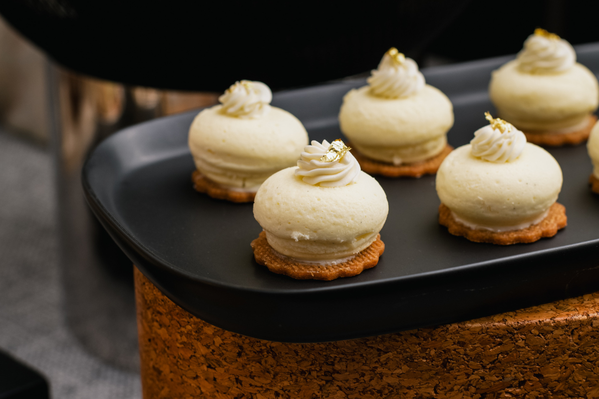 A bunch of desserts sitting on a cast iron platter