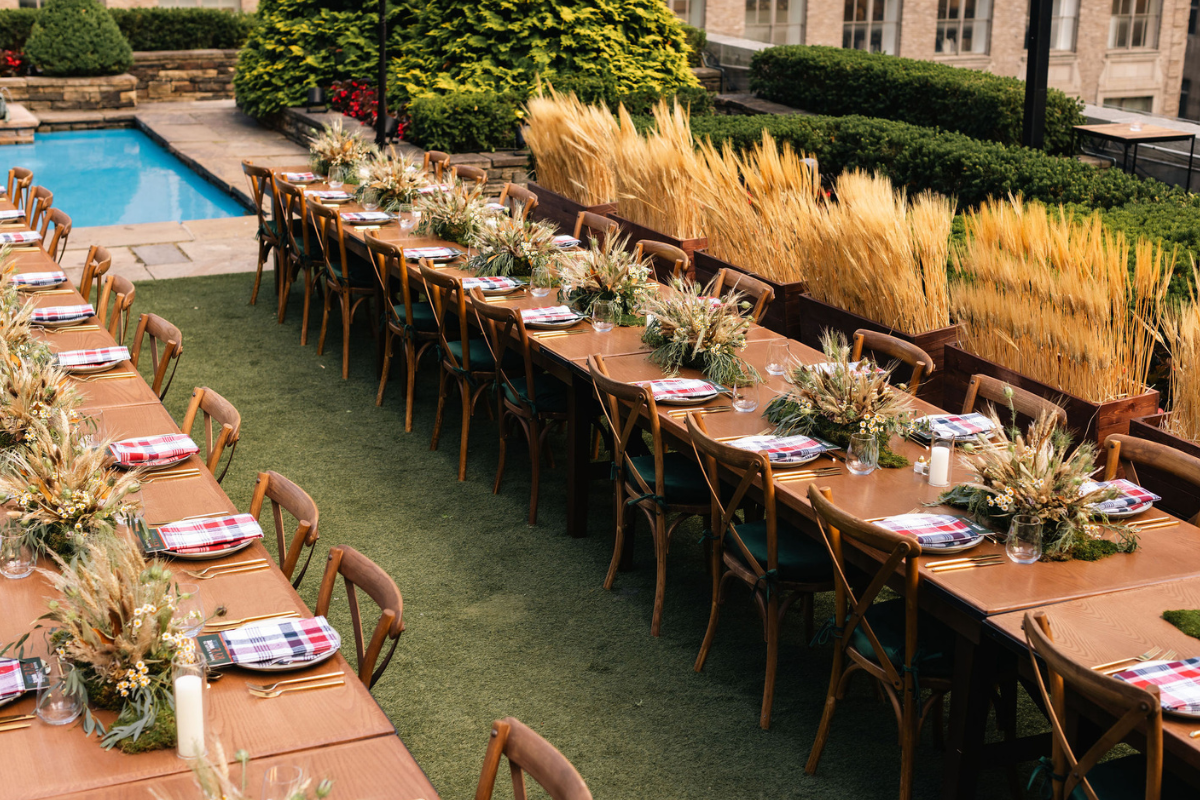 A bunch of tables all set up for a catering event