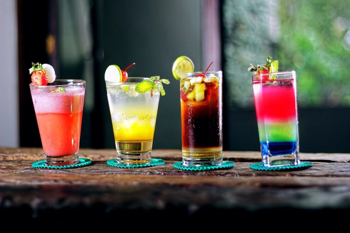 A bunch of cocktails all in a row on a table