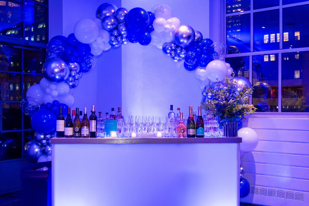 A bar with a bunch of balloons around it