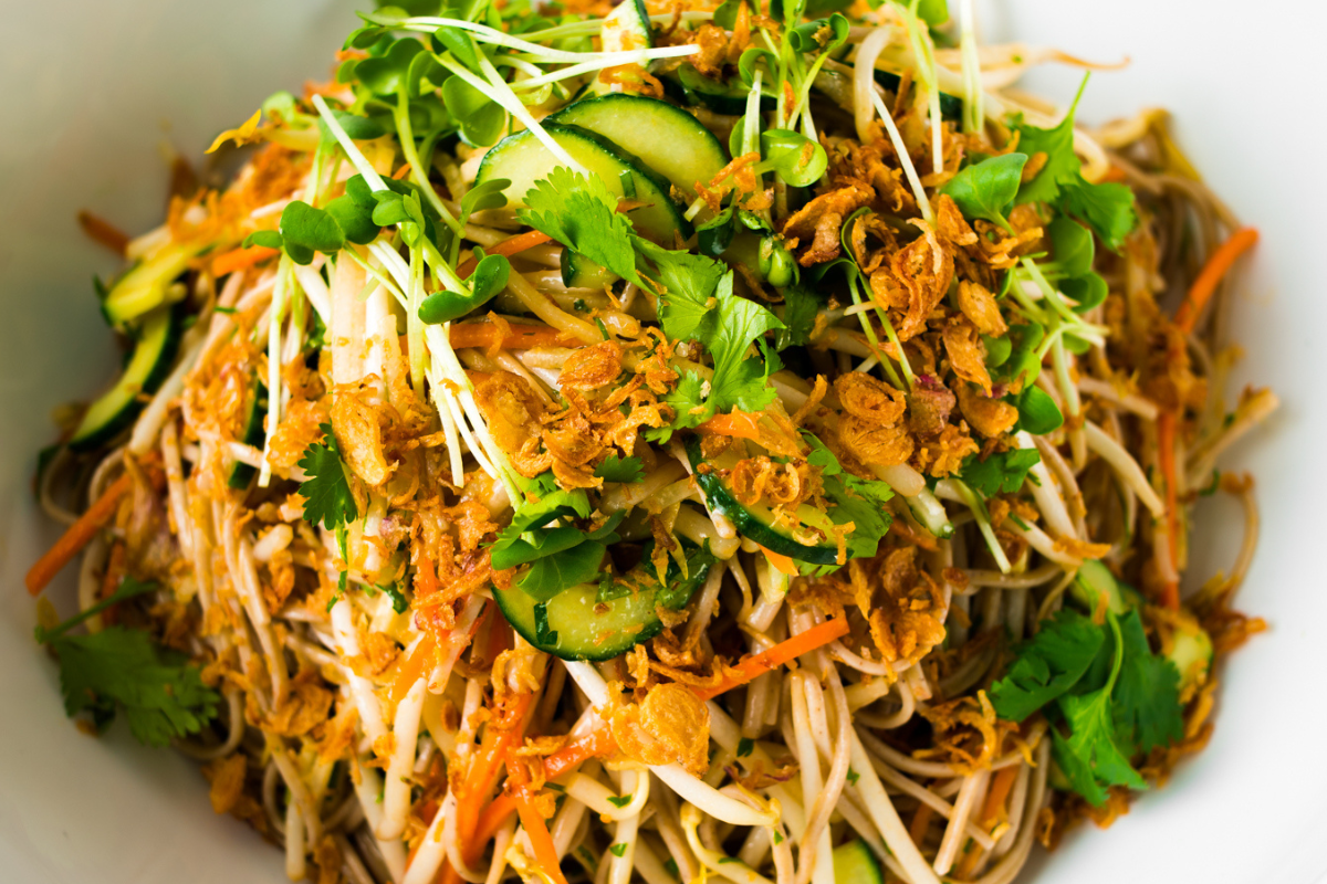 A dish sitting in a white bowl that is ready to eat