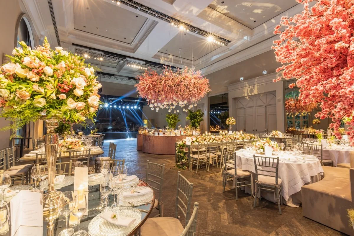 A venue with tables and chairs all set up for an event