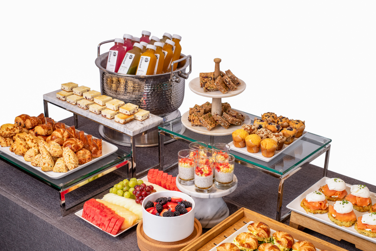 A bunch of food sitting on platters for station catering