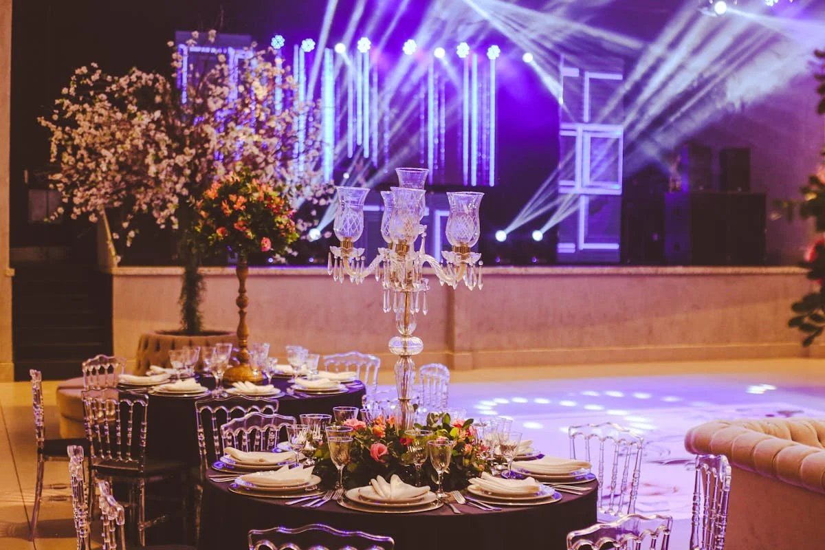 A bunch of tables set up in a venue
