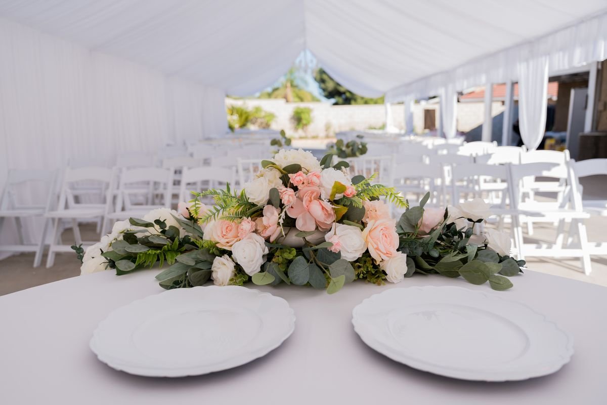 A tent with a wedding event planned underneath it