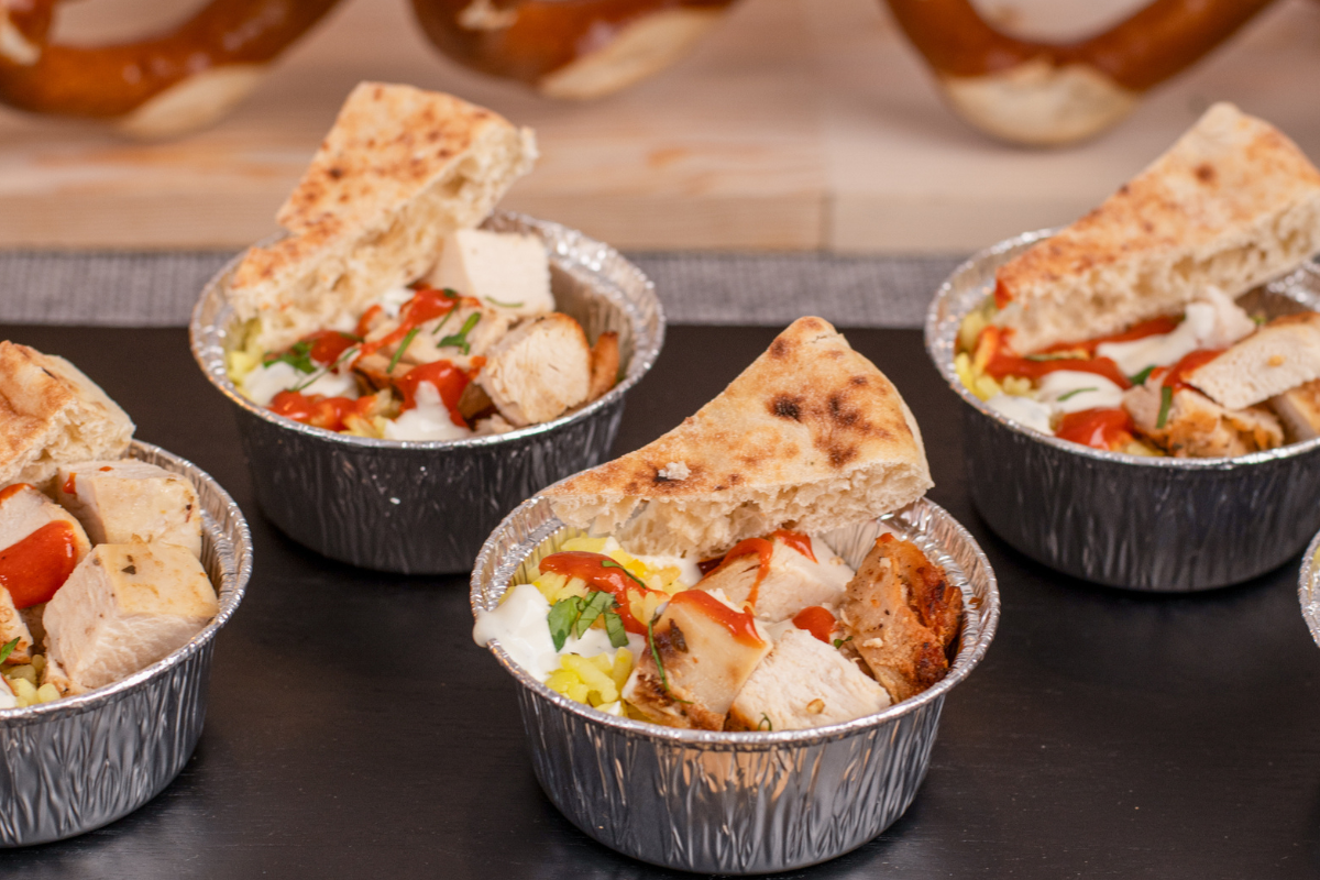 A bunch of little bowls with food in them
