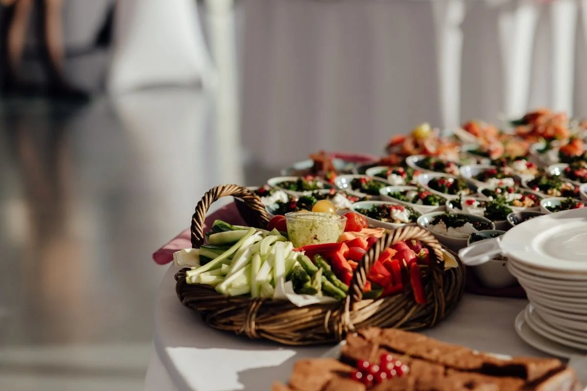 A bunch of platters of vegetables on a table