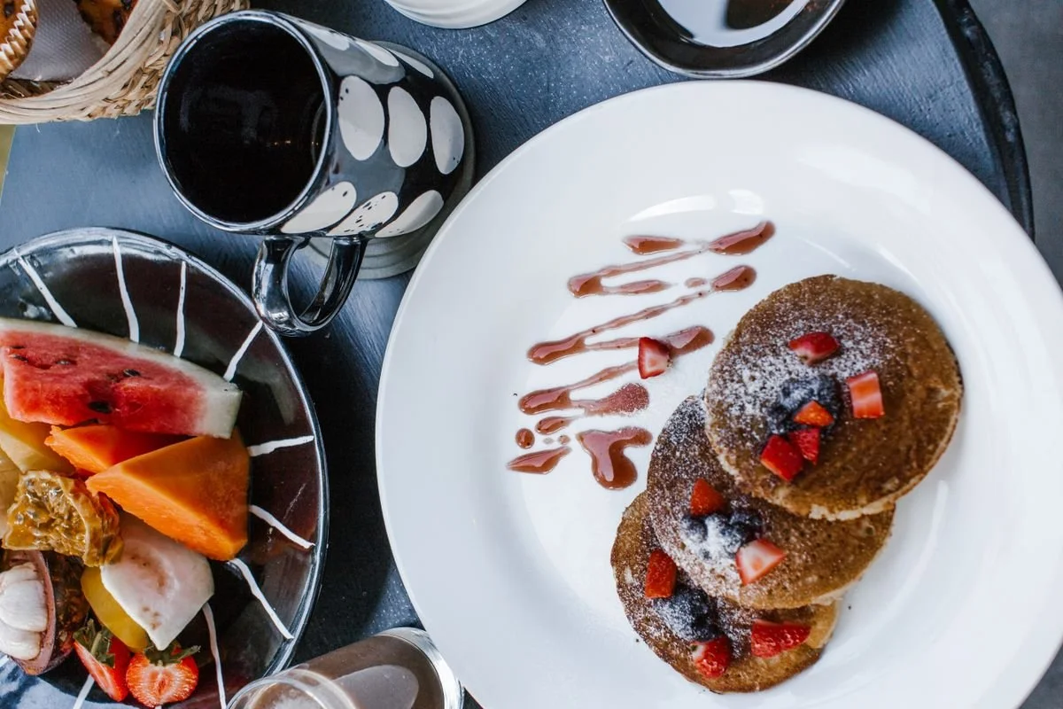 A giant white plate with pancakes on it