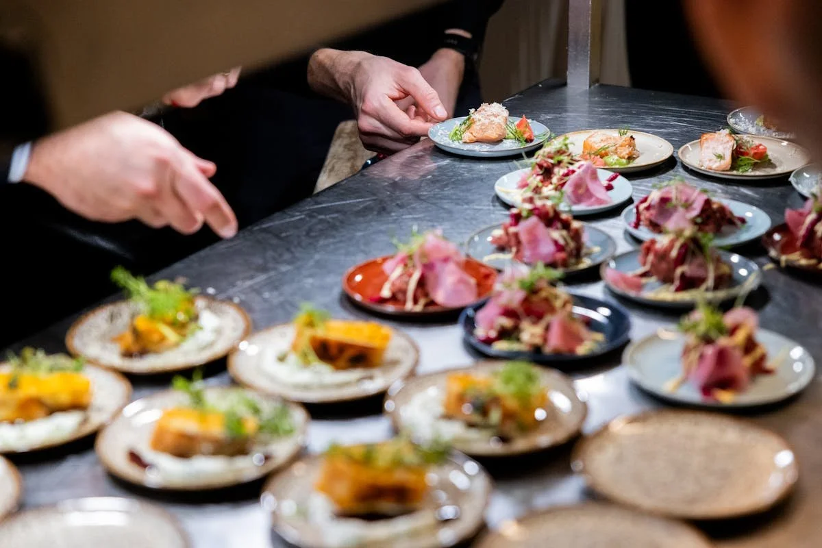 A bunch of small plates with appetizers on them