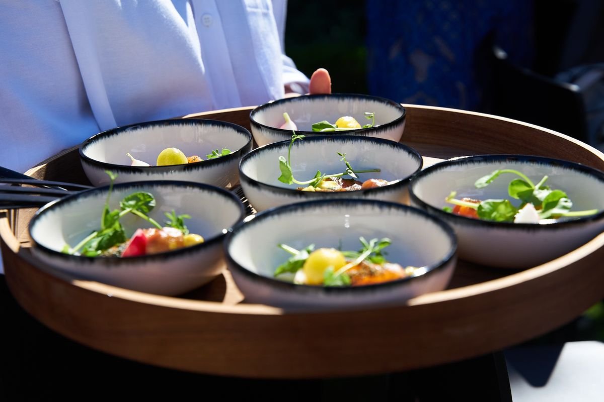 A bunch of bowls with food being served